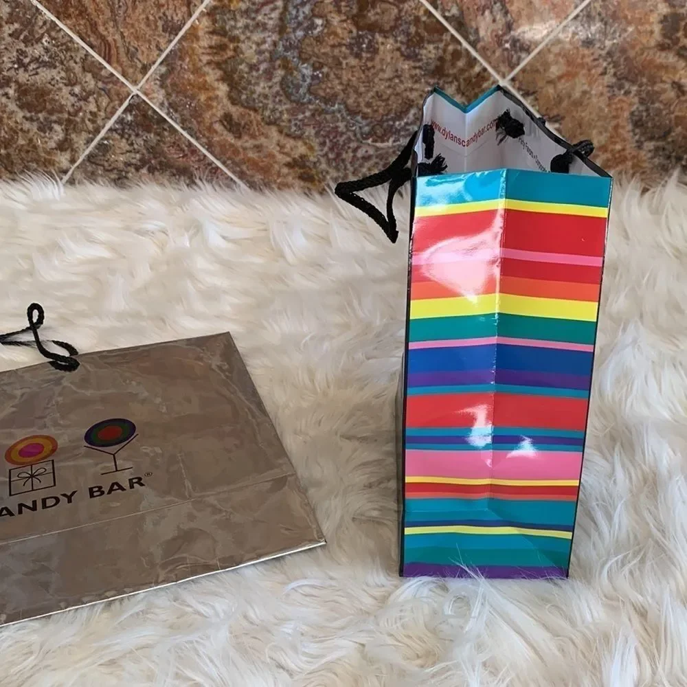 Dylan’s Candy Bar Paper Shopping Bags. One Black and One Silver Metallic.